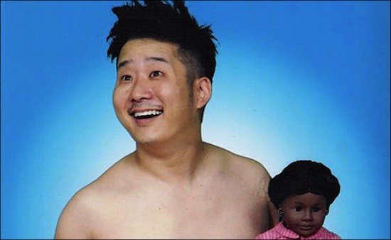 Bobby Lee is posing for a photo.