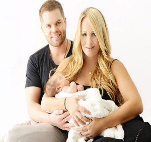 Wes Chatham and his wife, Jenn Brown with their first child, Nash