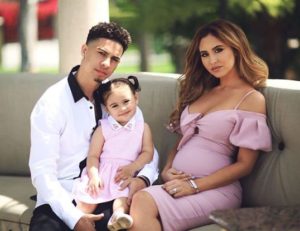 Austin McBroom and his wife and child