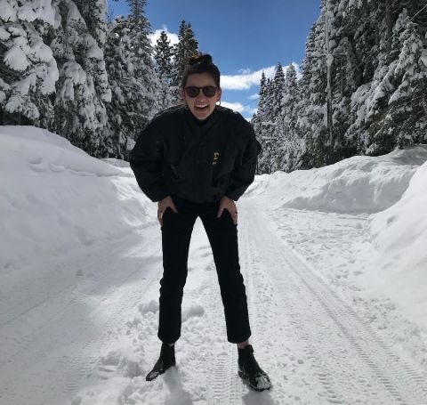 Jacqueline Toboni all in black at a snowy hill.