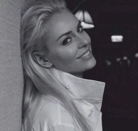 Lindsey Vonn in a white shirt poses for a photoshoot.