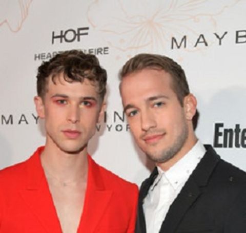Tommy Dorfman  with his husband Peter Zurkuhlen at a public event.