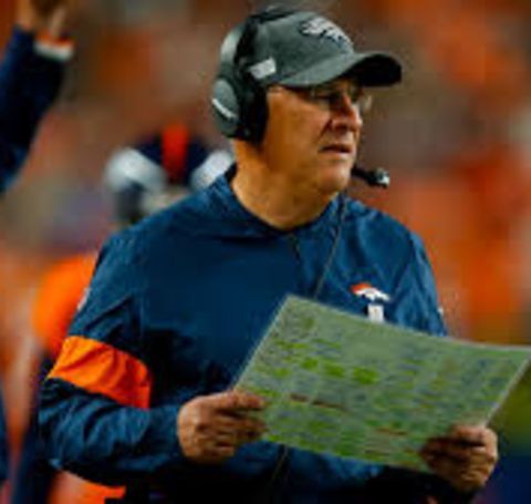 Vic Fangio in a blue t-shirt of Denver Broncos. 