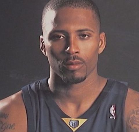 Lorenzen Wright in a black kit poses during a photoshoot. 