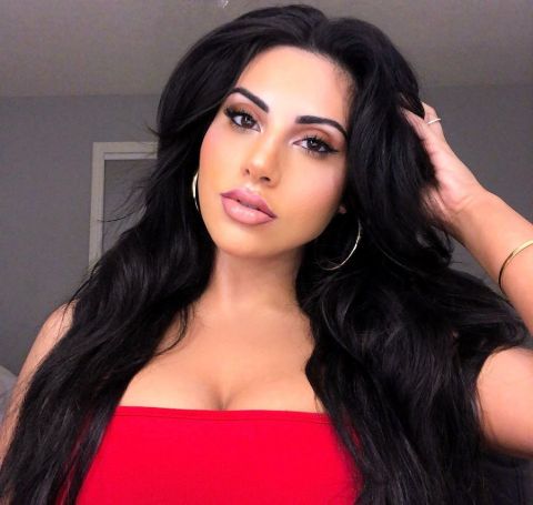 YouTube star Yasmin Kavari in a red dress poses for an Instagram picture.