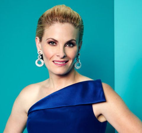 Marisa Zanuck in a blue outfit poses at a photoshoot.