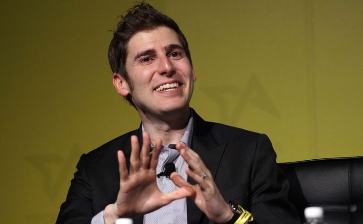 Eduardo Saverin in a black suit caught on camera during a seminar.