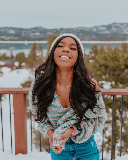 Teala Dunn poses for a picture smiling.
