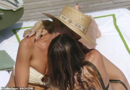 Miley Cyrus kissing Kaitlyn Carter while on a trip to Italy