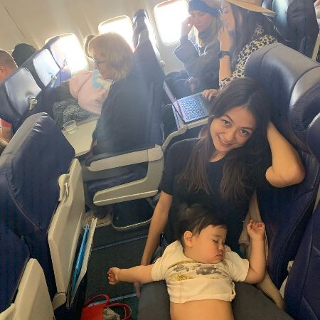 Karen Riotoc with her baby in a plane.