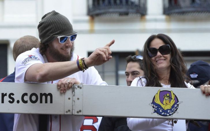 Ashley Saltalamacchia with her husband waving to the crowd